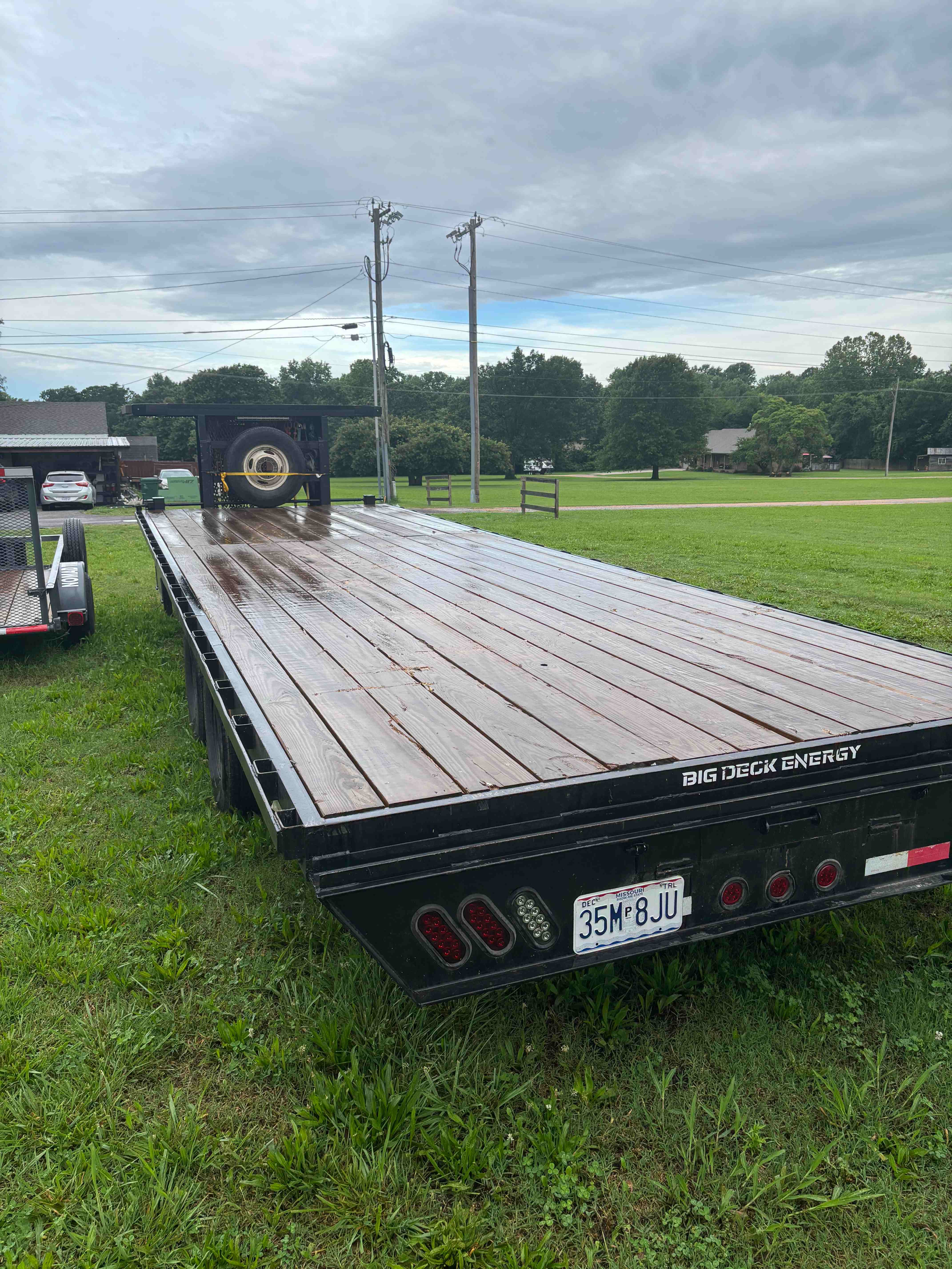 Gooseneck trailer rear view with Big Deck Energy branding - Nomad Trailer Rental